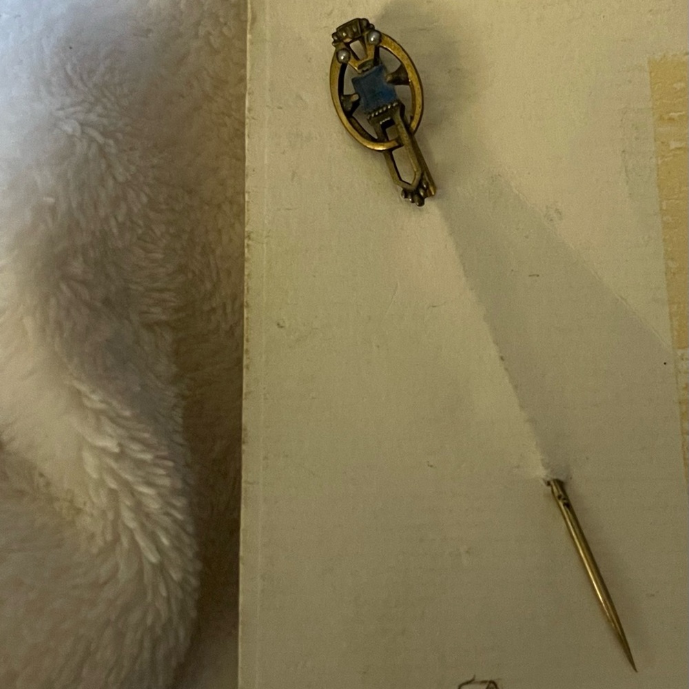Antique stick pin with blue stone. Sapphire?